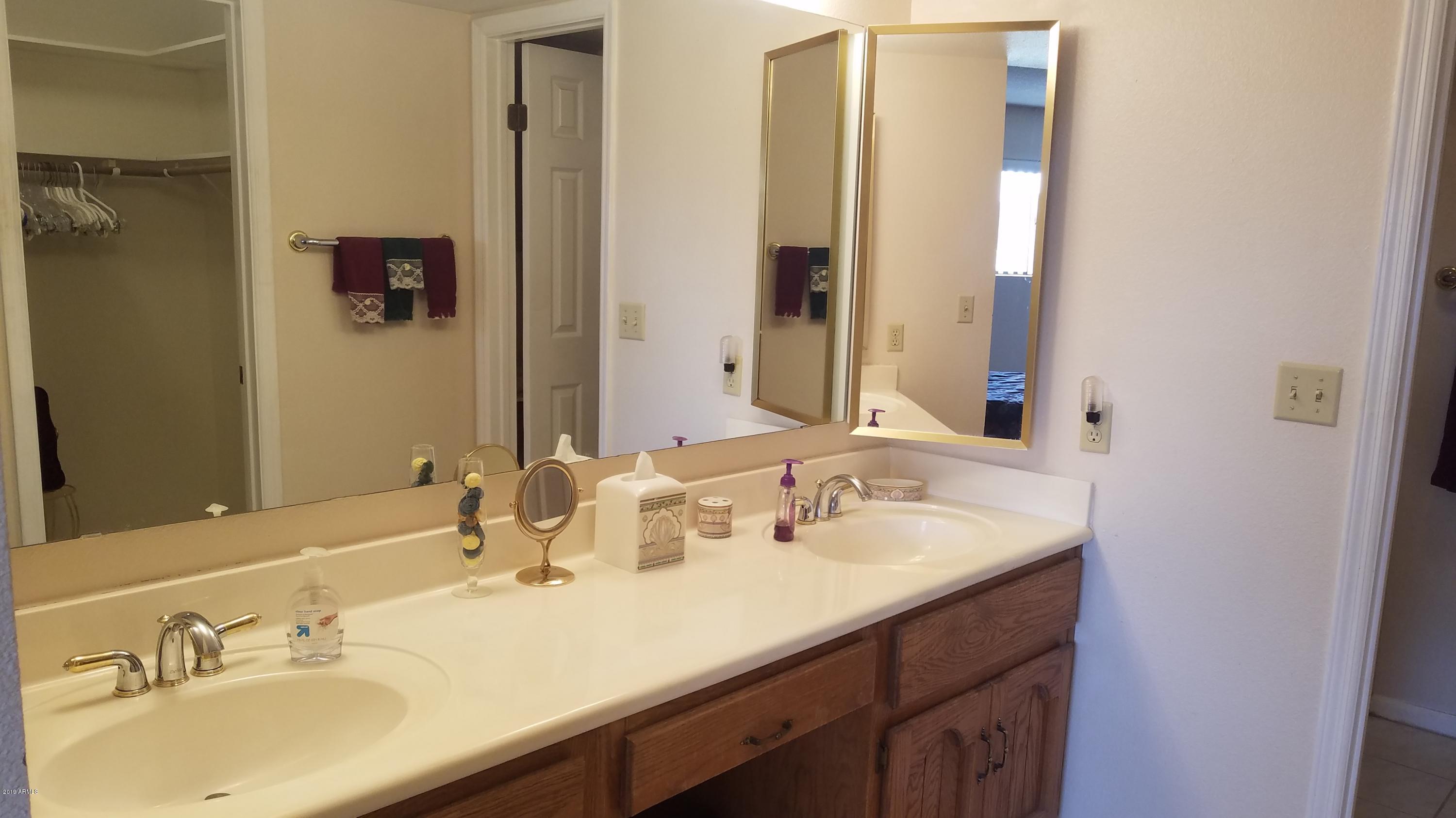 7061 East Broadway Road, Unit 48 Mesa, AZ 85208 - Photo 29 of 41 a bathroom with 2 sink and a mirror