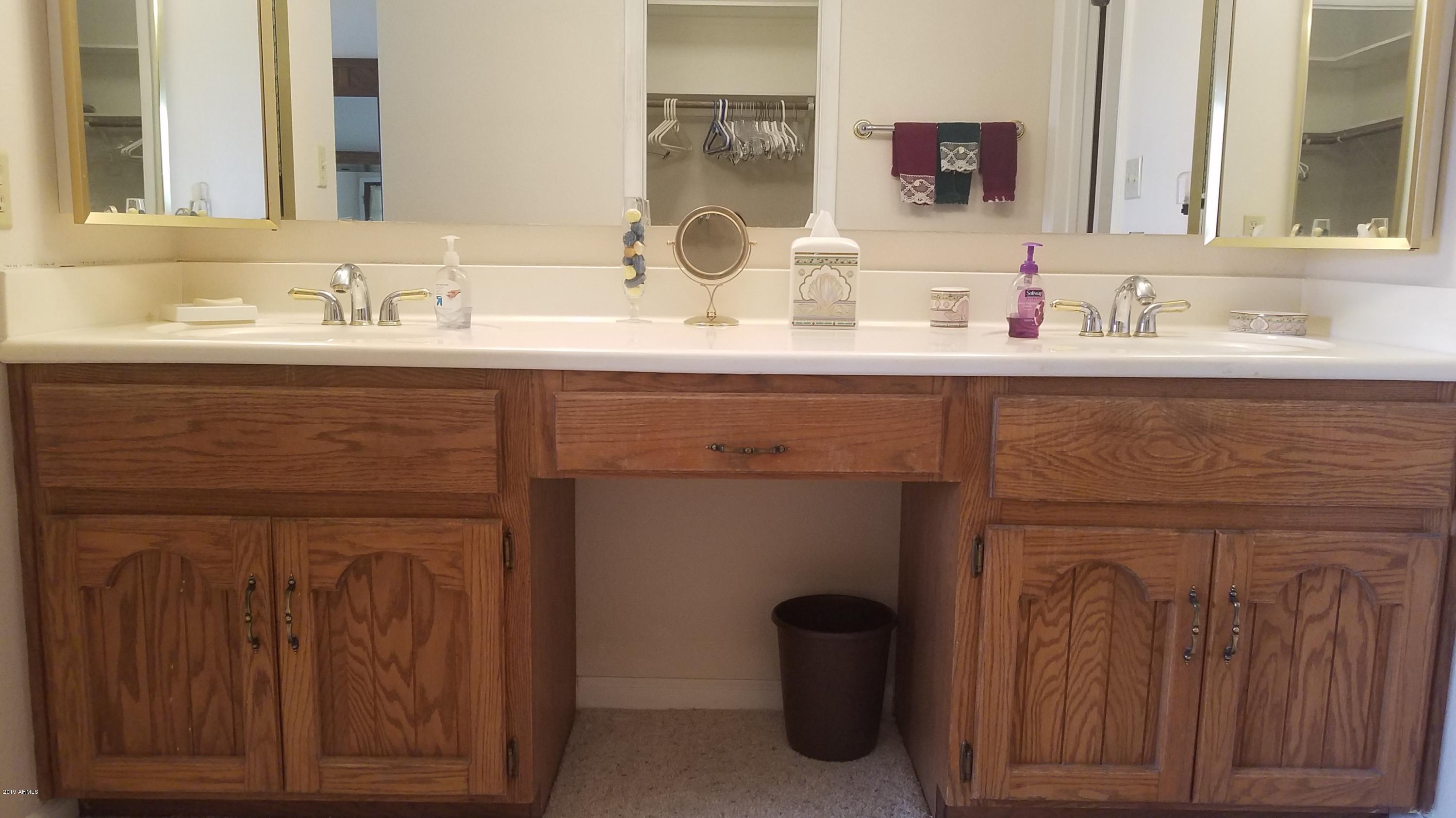 7061 East Broadway Road, Unit 48 Mesa, AZ 85208 - Photo 30 of 41 a bathroom with a sink and a mirror