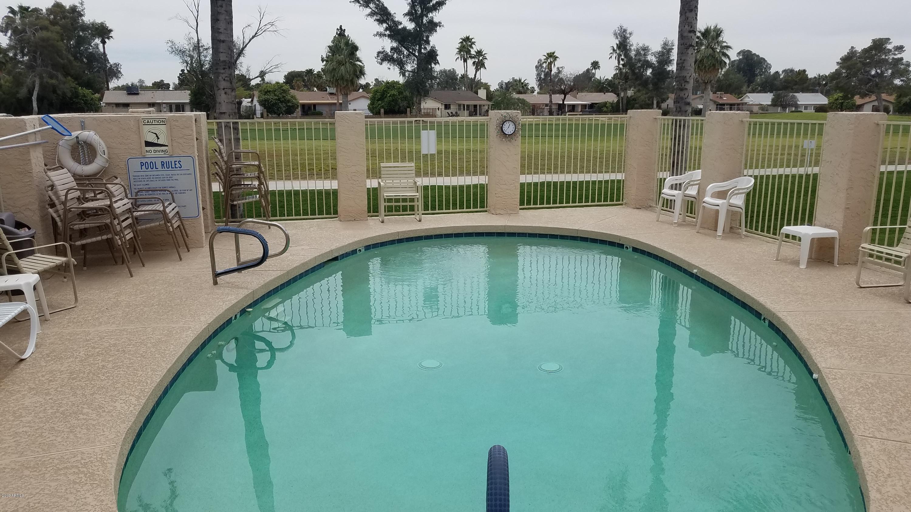 7061 East Broadway Road, Unit 48 Mesa, AZ 85208 - Photo 39 of 41 a view of a lake with a deck