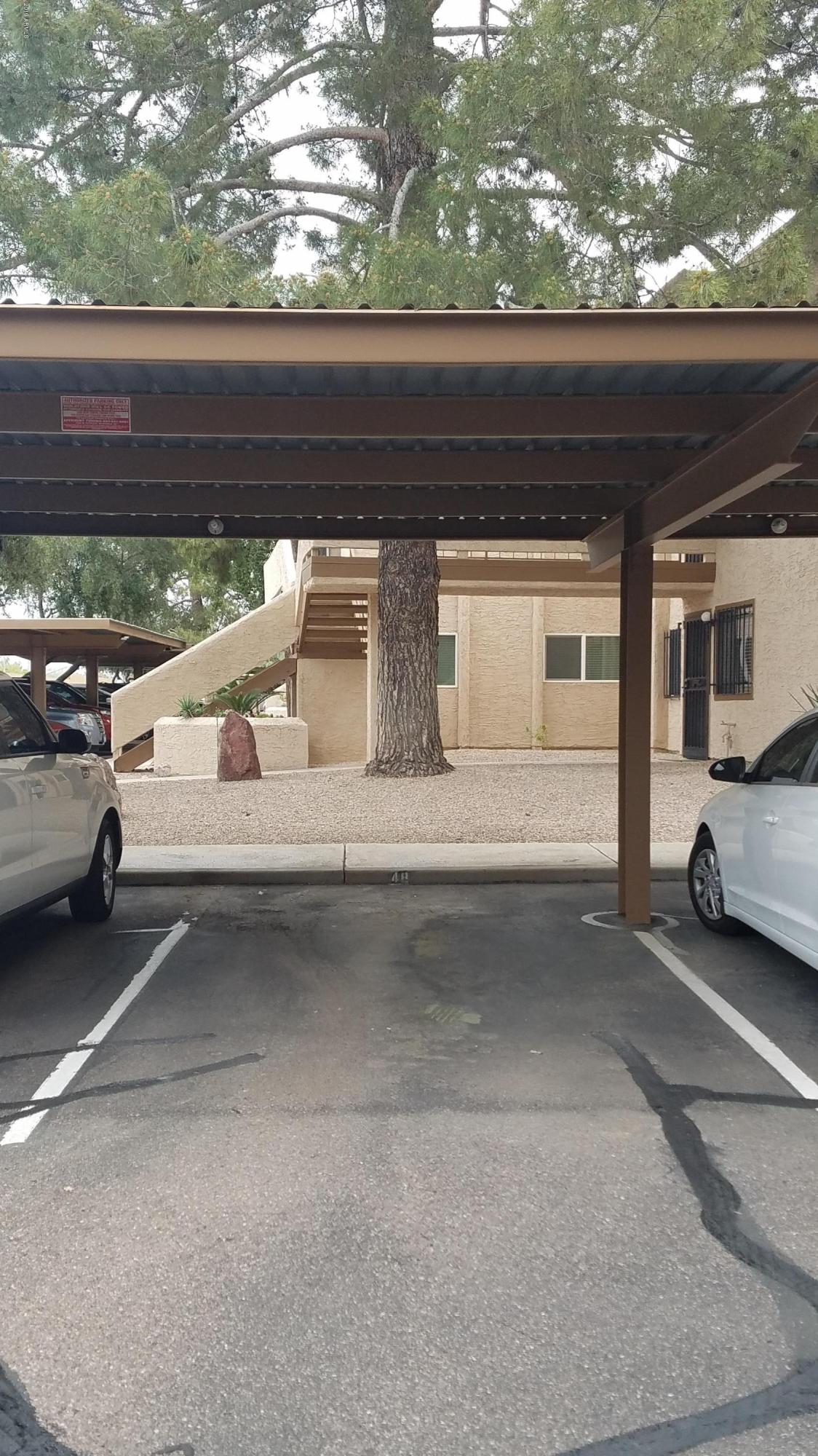 7061 East Broadway Road, Unit 48 Mesa, AZ 85208 - Photo 41 of 41 a view of garage with a car parked in it