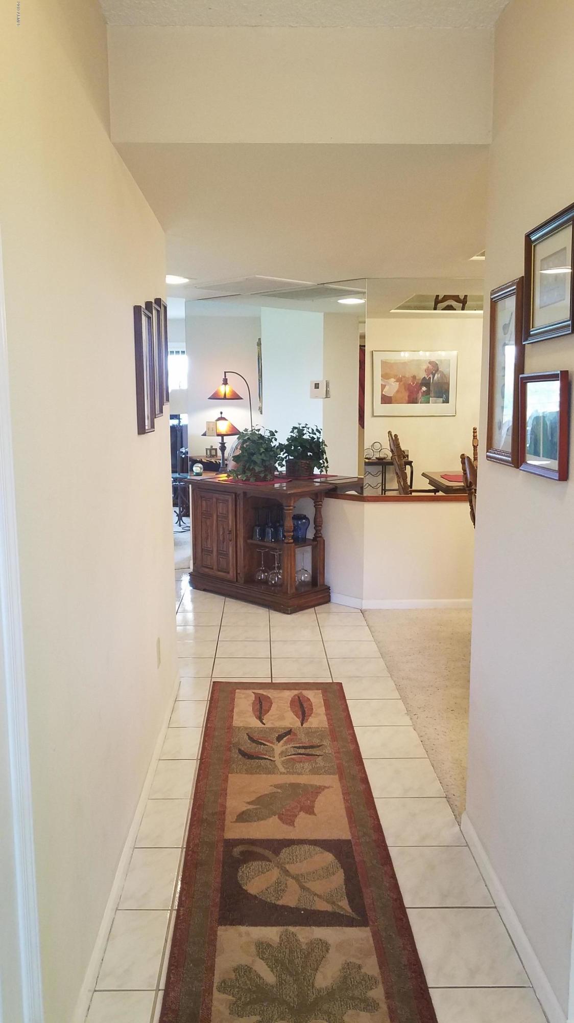7061 East Broadway Road, Unit 48 Mesa, AZ 85208 - Photo 6 of 41 a view of a living room with furniture