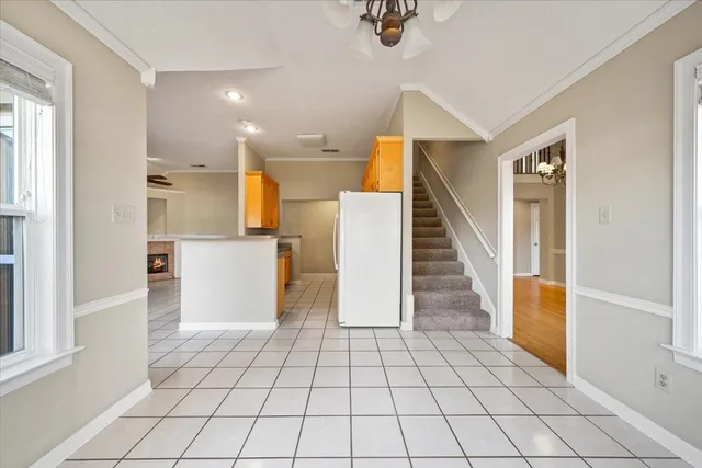 a view of an entryway with white walls and windows