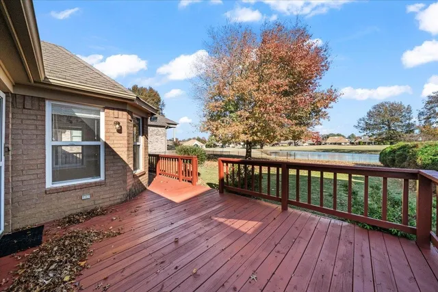 a view of a house with wooden deck