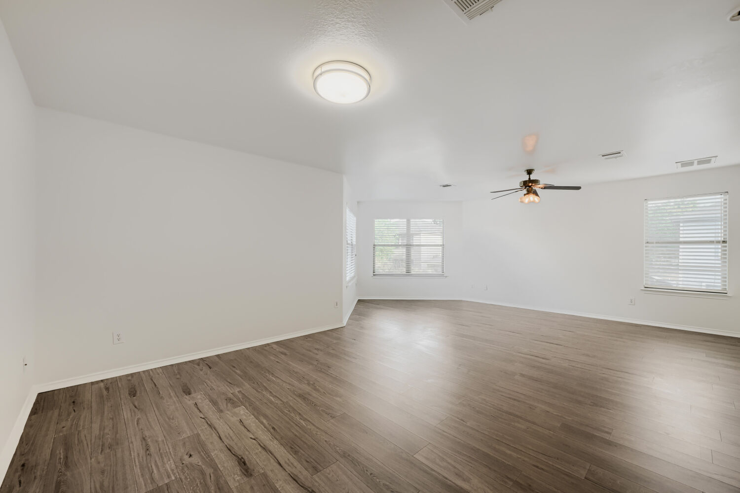 4508 Peach Grove Road Austin, TX 78744 - Photo 15 of 22 Bedroom with extra space illuminated by multiple windows.