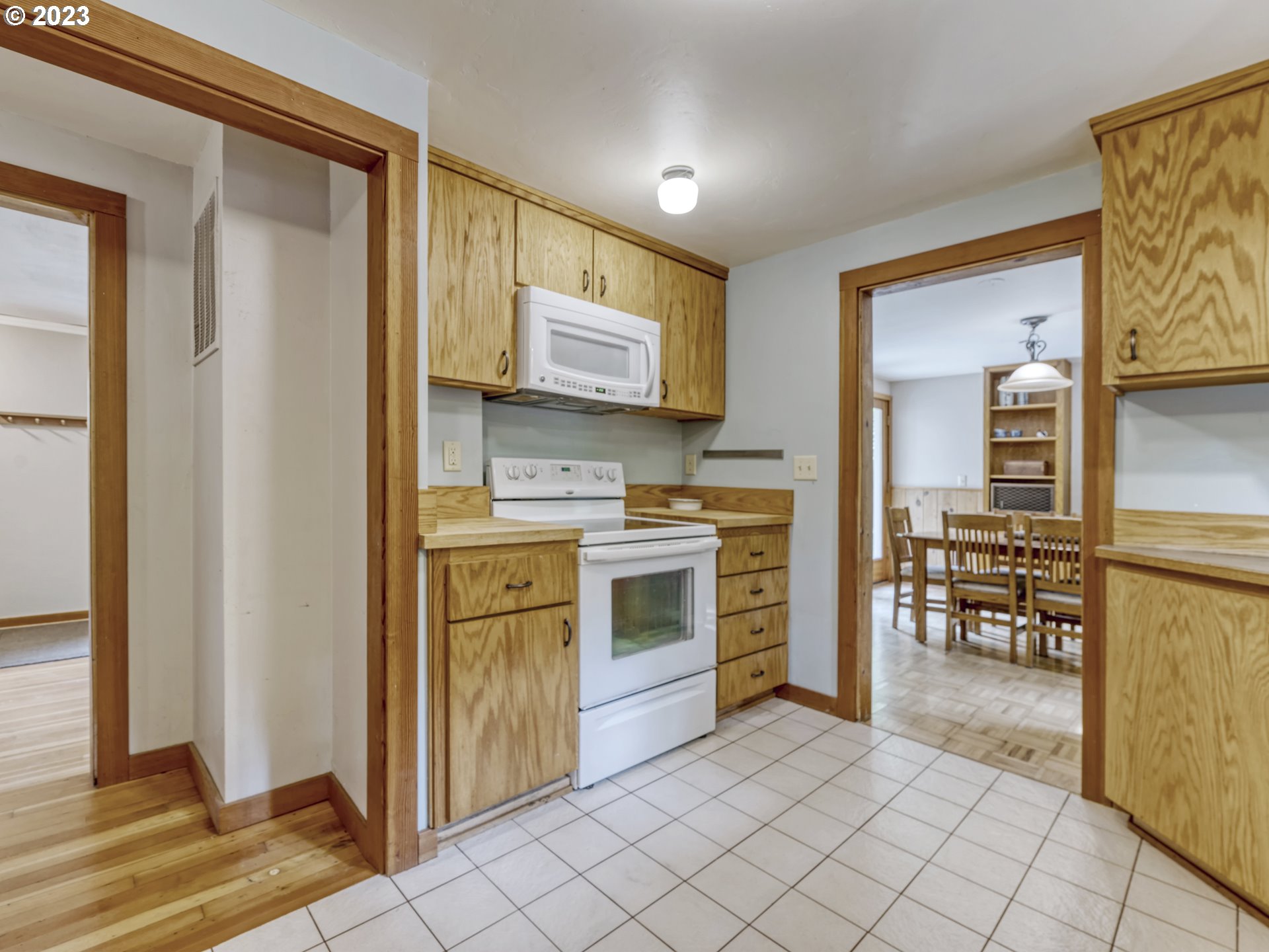 2660 Emerald Street Eugene, OR 97403 - Photo 11 of 36 a kitchen with stainless steel appliances a stove top oven and a refrigerator