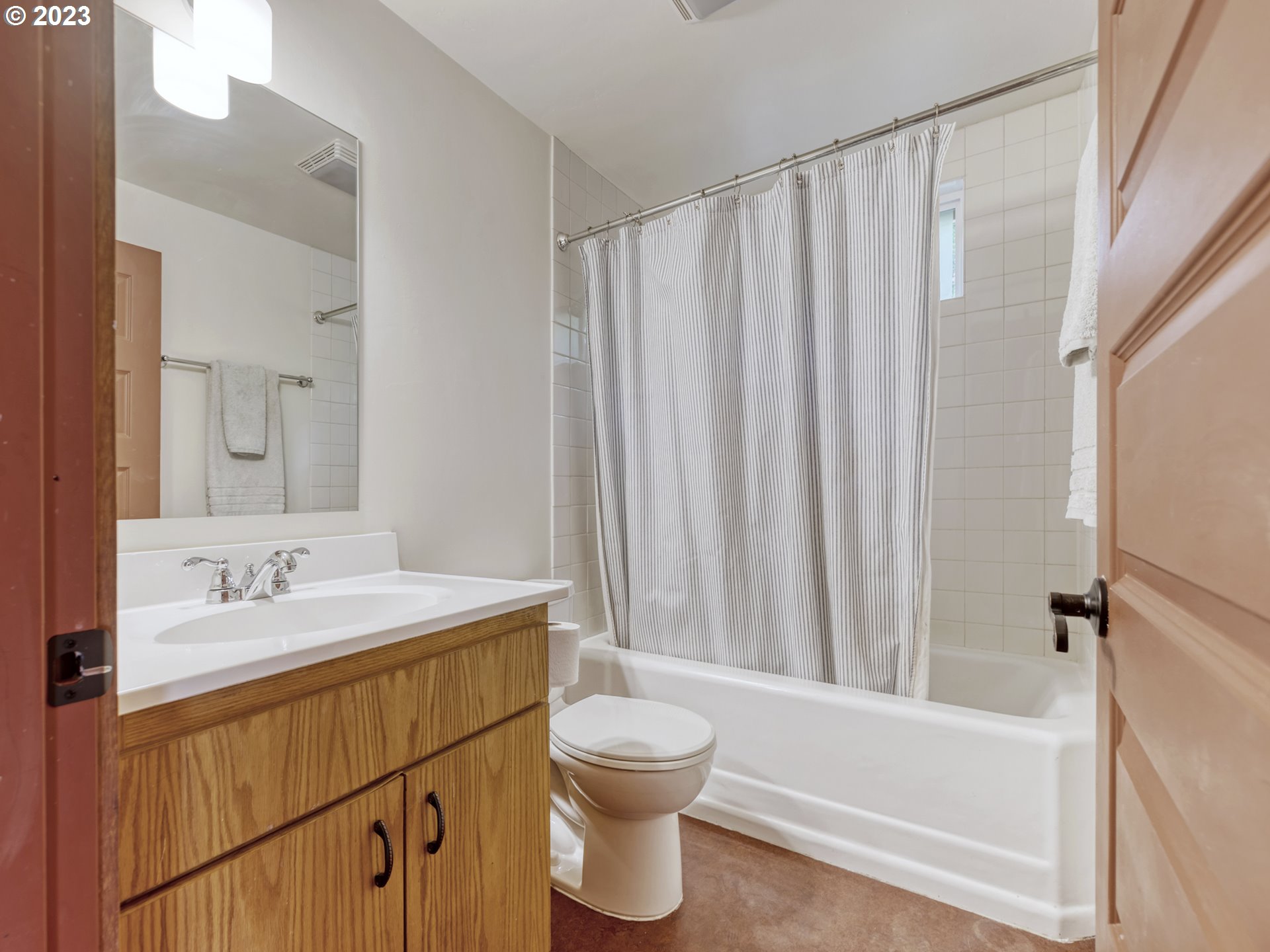 2660 Emerald Street Eugene, OR 97403 - Photo 12 of 36 a bathroom with a sink a toilet and a bathtub