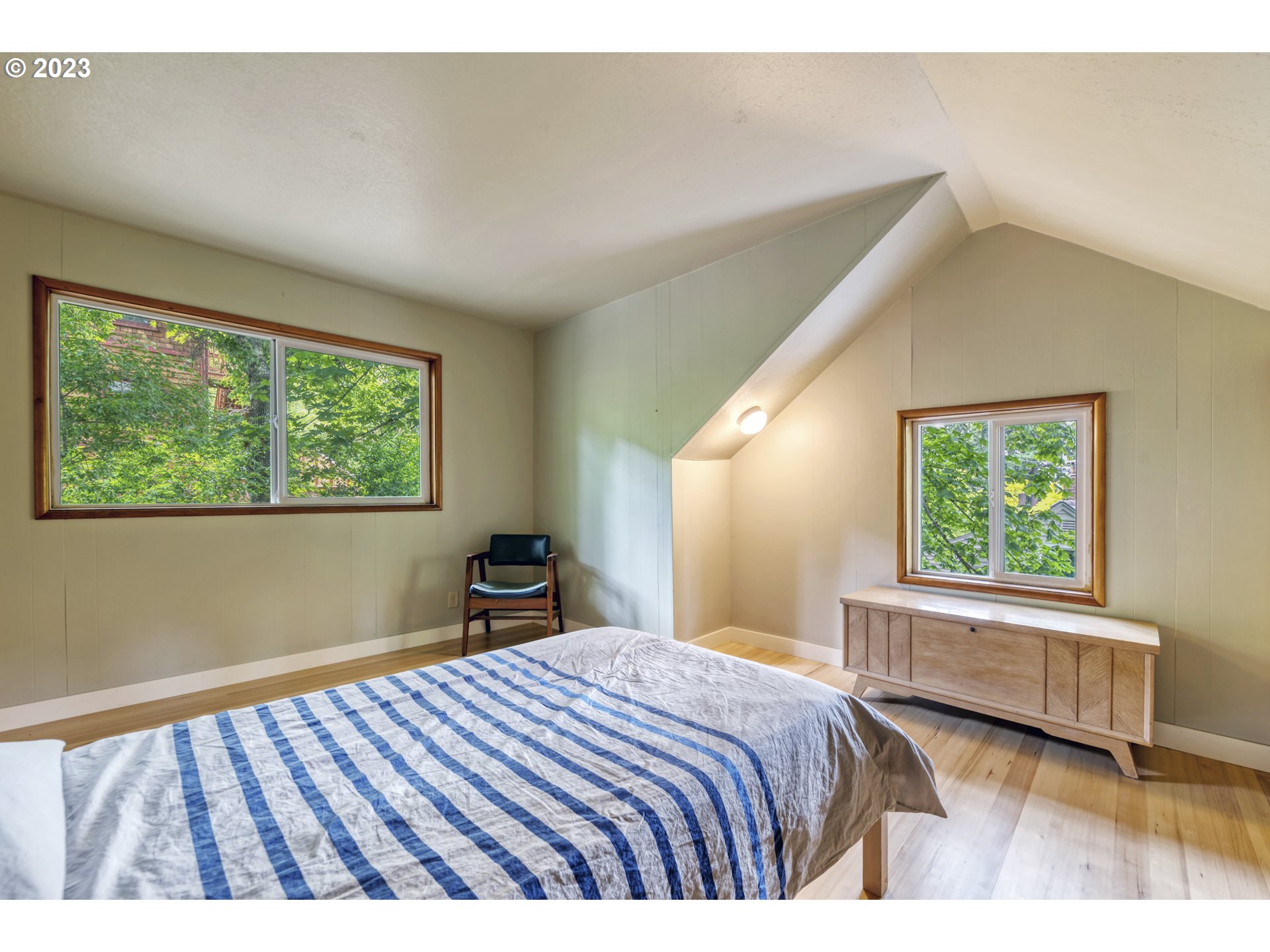 2660 Emerald Street Eugene, OR 97403 - Photo 17 of 36 a bedroom with a bed and a large window