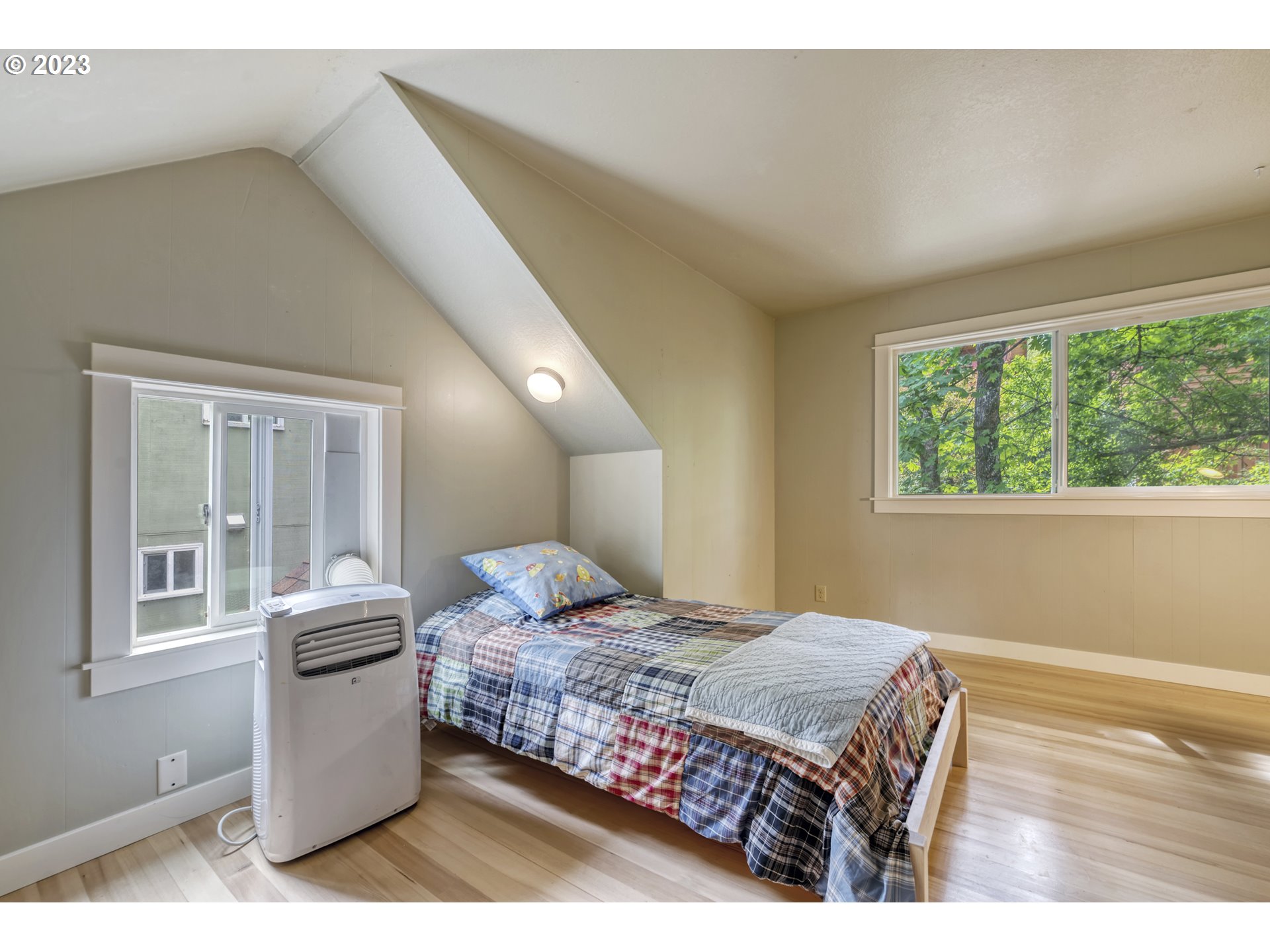 2660 Emerald Street Eugene, OR 97403 - Photo 19 of 36 a bedroom with a bed and a window
