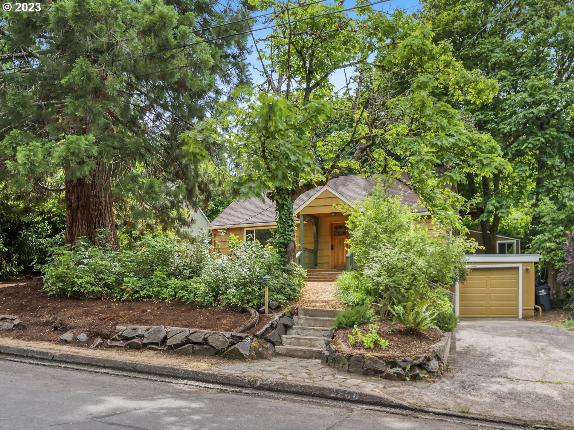 2660 Emerald Street Eugene, OR 97403 - Photo 22 of 36 a front view of a house with a yard and tree s