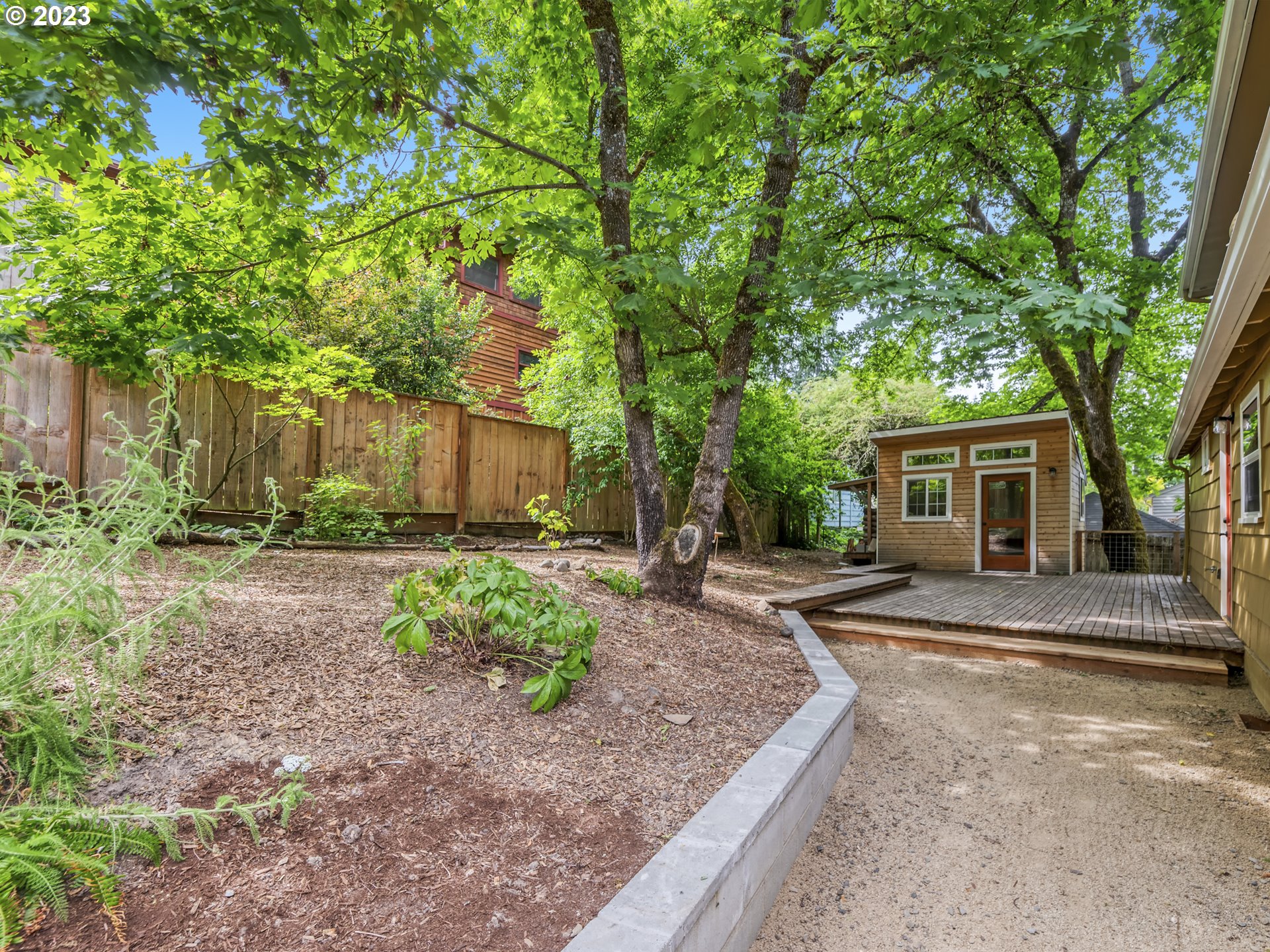2660 Emerald Street Eugene, OR 97403 - Photo 23 of 36 a view of a house with yard and a tree