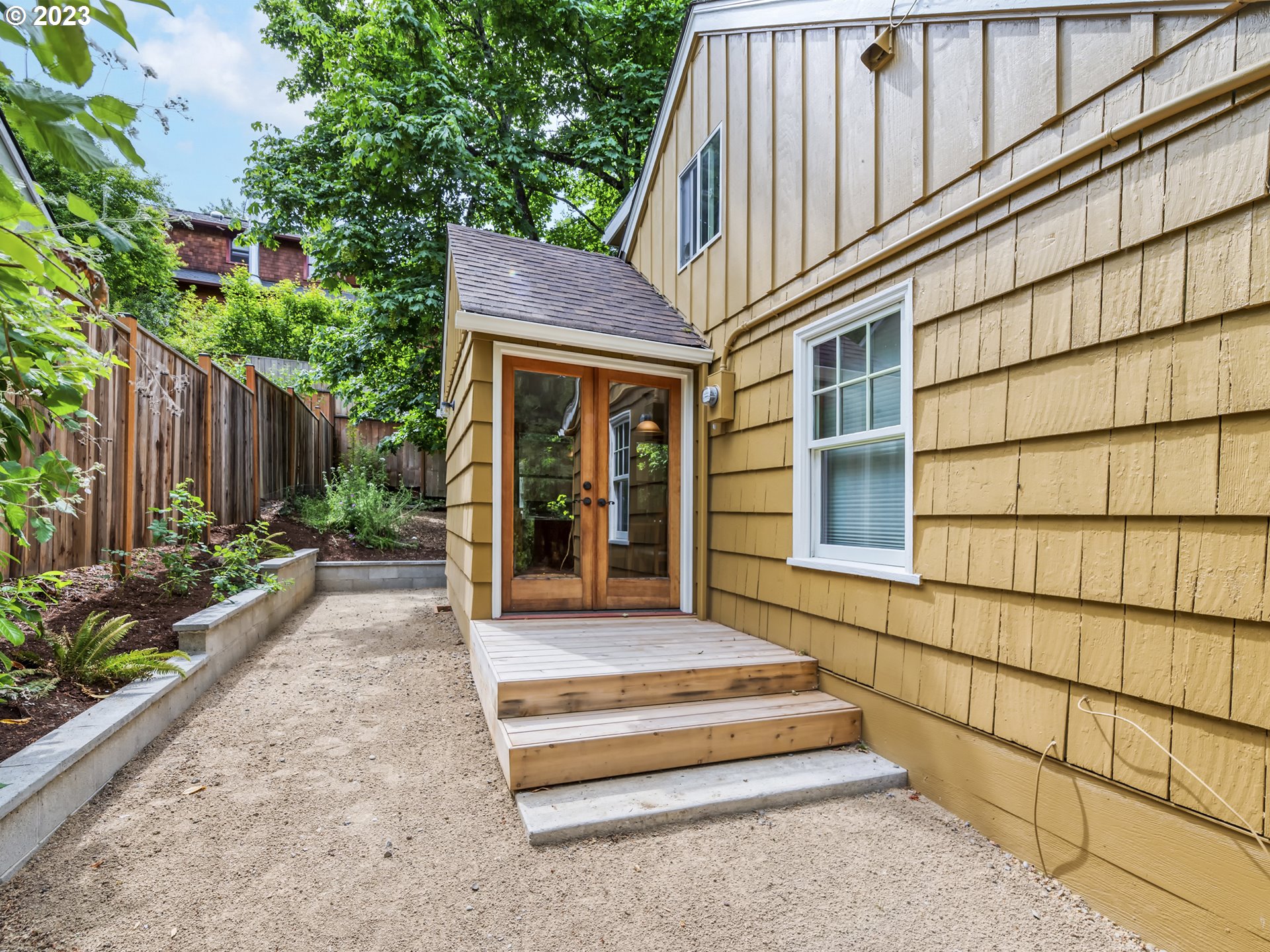 2660 Emerald Street Eugene, OR 97403 - Photo 30 of 36 a front view of a house with a garden and plants