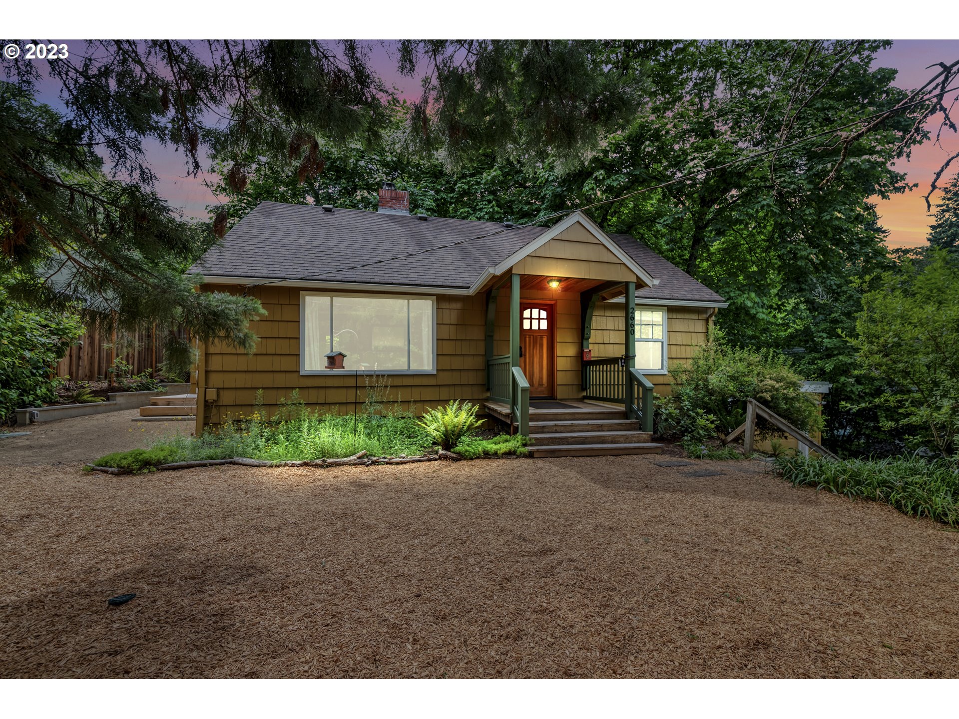 2660 Emerald Street Eugene, OR 97403 - Photo 34 of 36 a front view of a house with a garden