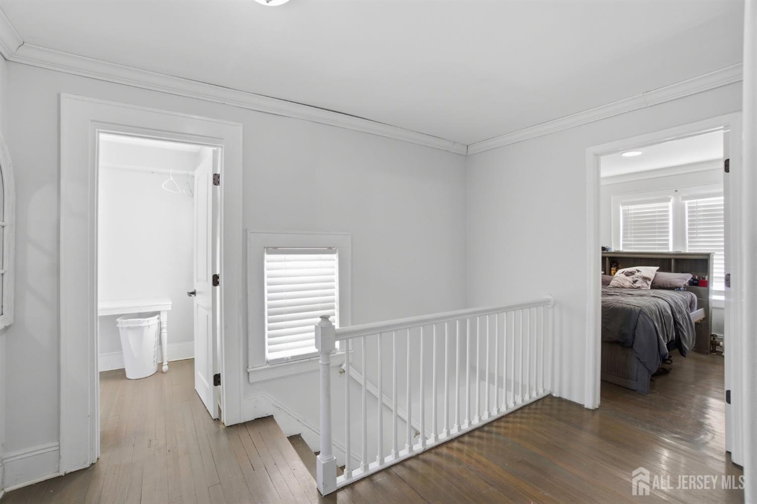 241 Hillside Road Elizabeth, NJ 07208 - Photo 12 of 33 a view of a hallway view with wooden floor and closet