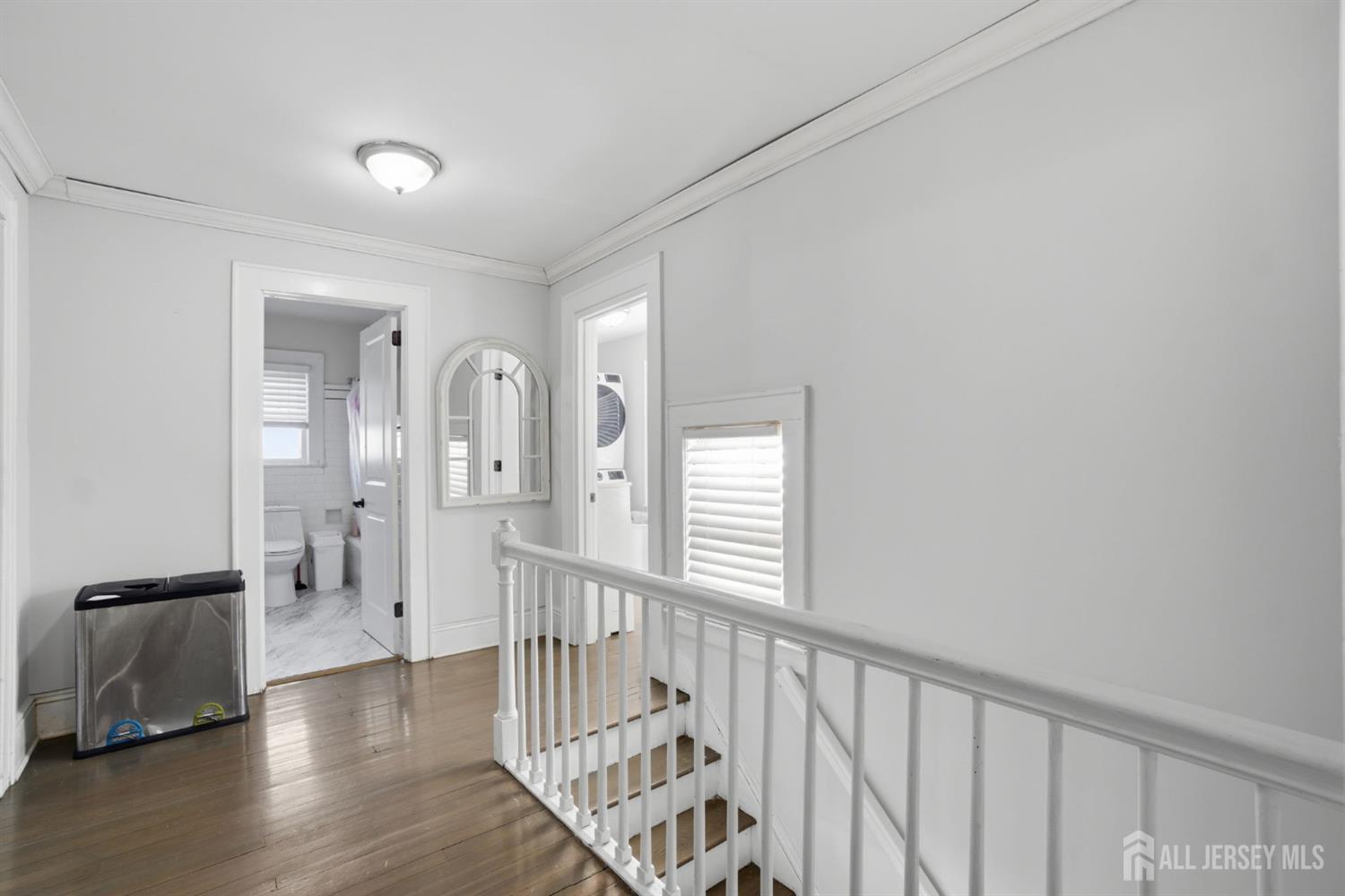 241 Hillside Road Elizabeth, NJ 07208 - Photo 14 of 33 a view of a hallway with wooden floor and windows