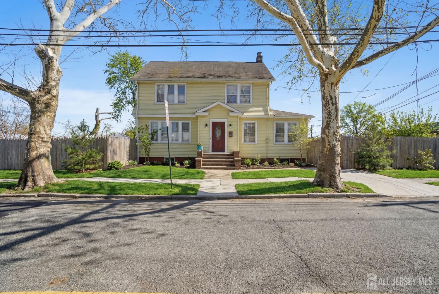 241 Hillside Road Elizabeth, NJ 07208 - Photo 23 of 33 a front view of house with yard and green space