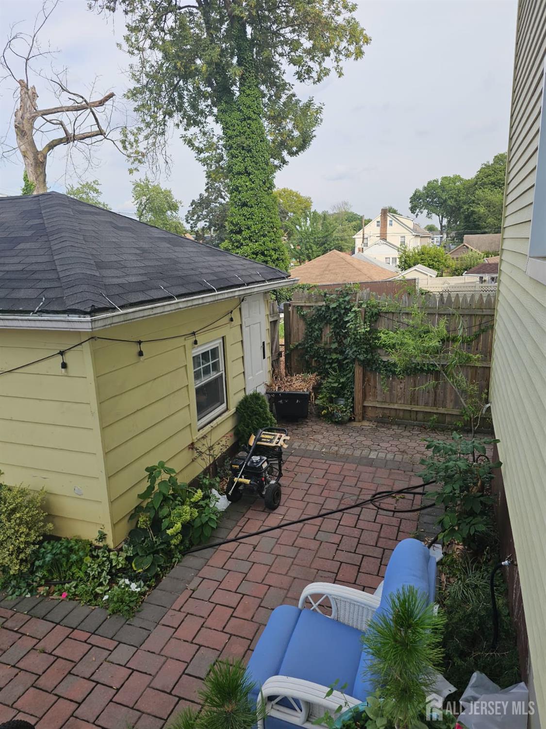 241 Hillside Road Elizabeth, NJ 07208 - Photo 32 of 33 a view of a backyard with plants and a patio
