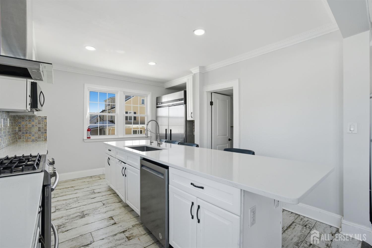 241 Hillside Road Elizabeth, NJ 07208 - Photo 4 of 33 a kitchen with granite countertop a sink and cabinets