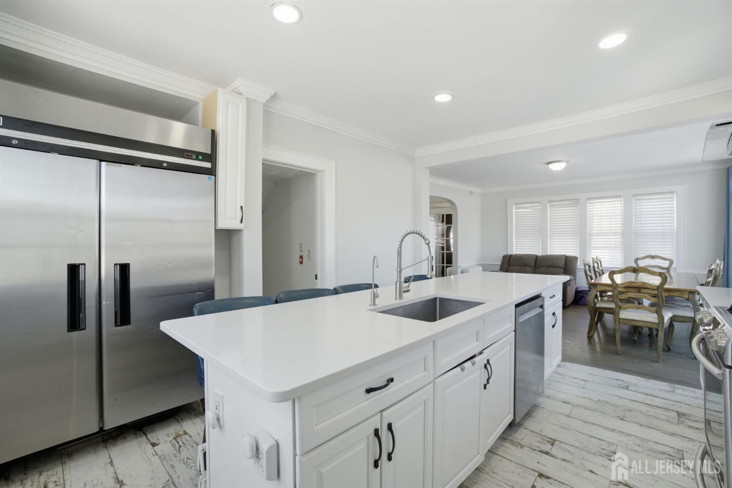 241 Hillside Road Elizabeth, NJ 07208 - Photo 5 of 33 a kitchen with sink and refrigerator