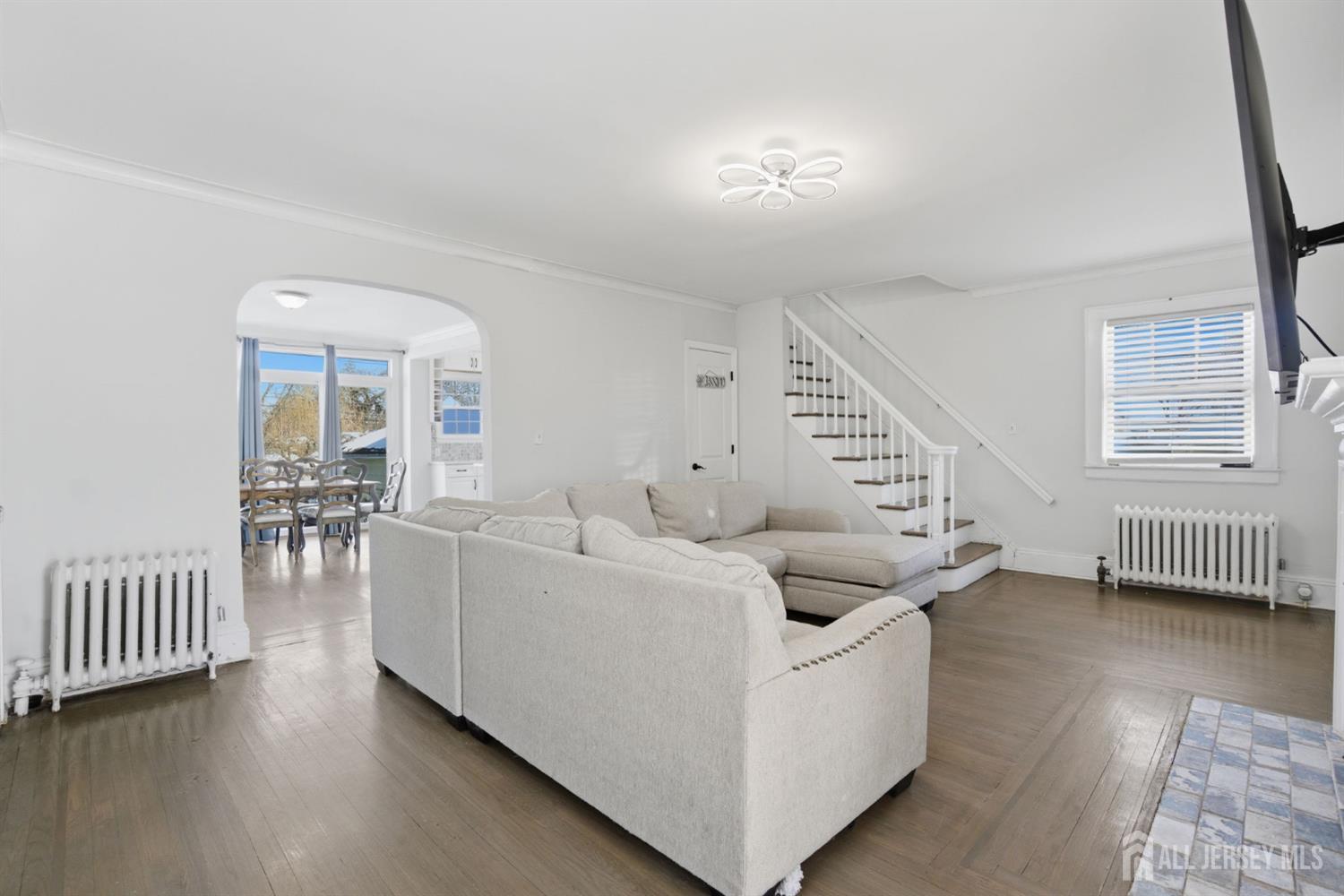 241 Hillside Road Elizabeth, NJ 07208 - Photo 6 of 33 a living room with furniture and a wooden floor