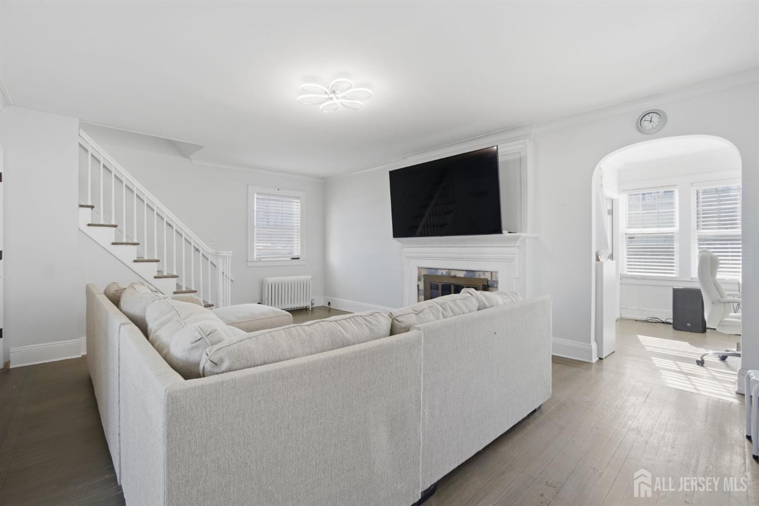 241 Hillside Road Elizabeth, NJ 07208 - Photo 7 of 33 a living room with furniture and a flat screen tv