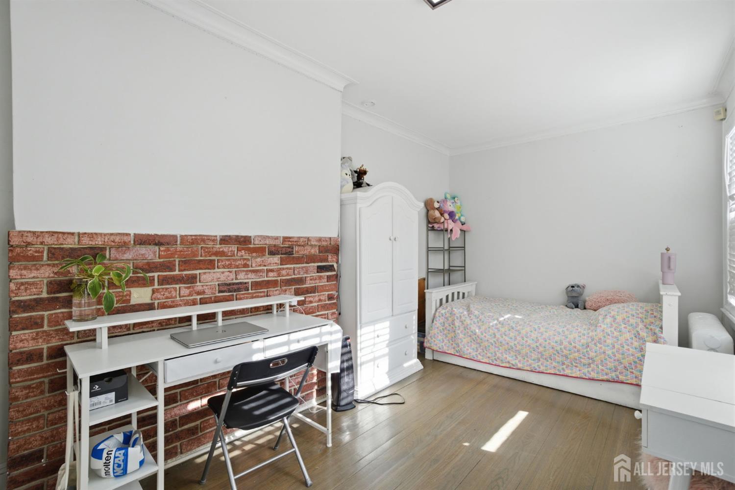 241 Hillside Road Elizabeth, NJ 07208 - Photo 8 of 33 a living room with a couch and a table