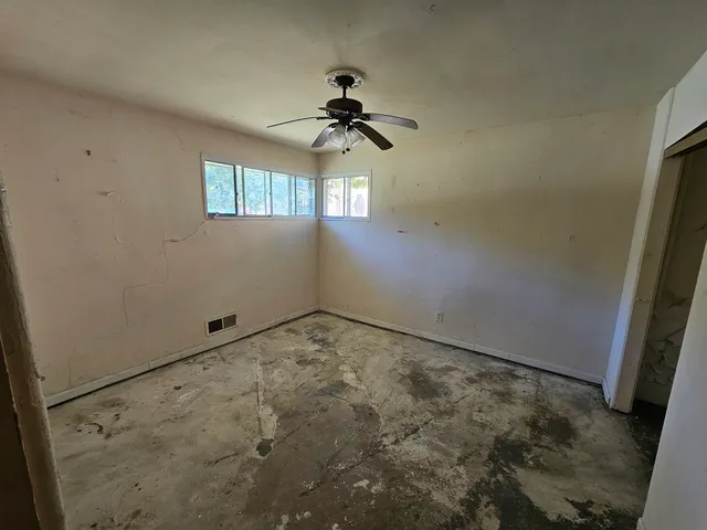 a view of empty room with windows