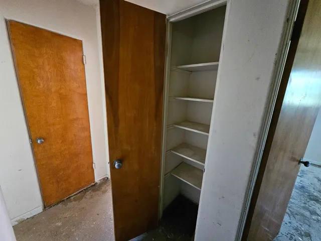 a bathroom with a granite countertop shower a sink and a mirror