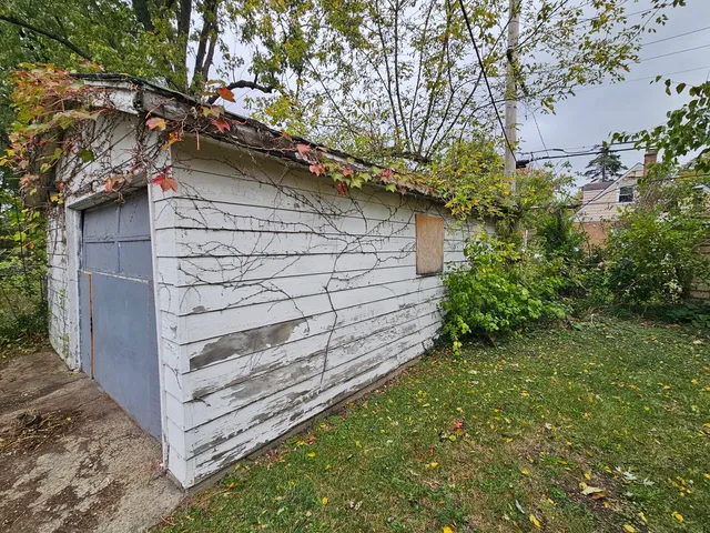 a view of wooden house with a tree