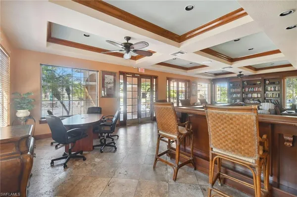 a dining room with furniture a rug and a chandelier
