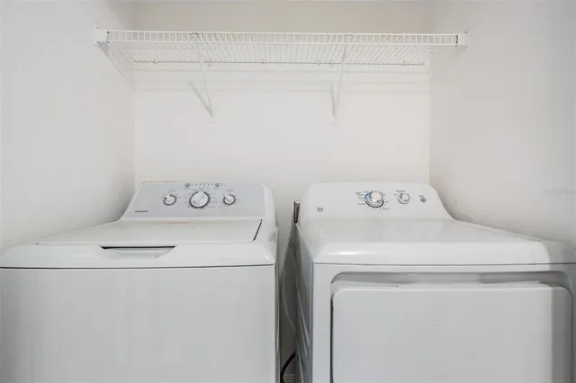 a utility room with dryer and washer