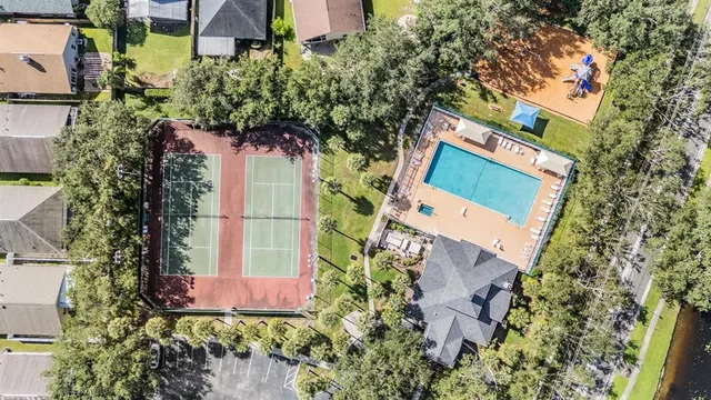 an aerial view of a house with a yard and garden