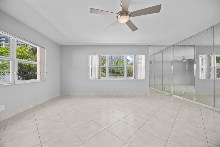 3213 Colony Club Road, Unit 3E Pompano Beach, FL 33062 - Photo 12 of 31 a view of an empty room with a window