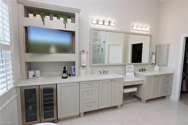 a bathroom with a double vanity sink and mirror
