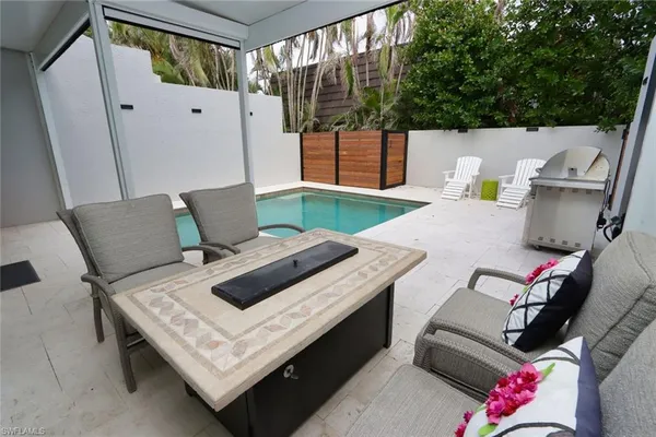 a view of table and chairs in patio