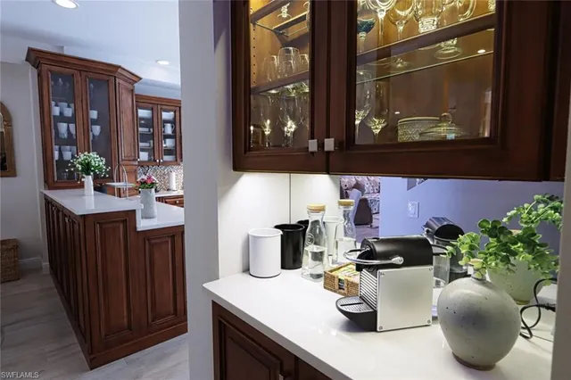 a kitchen with a sink and cabinets