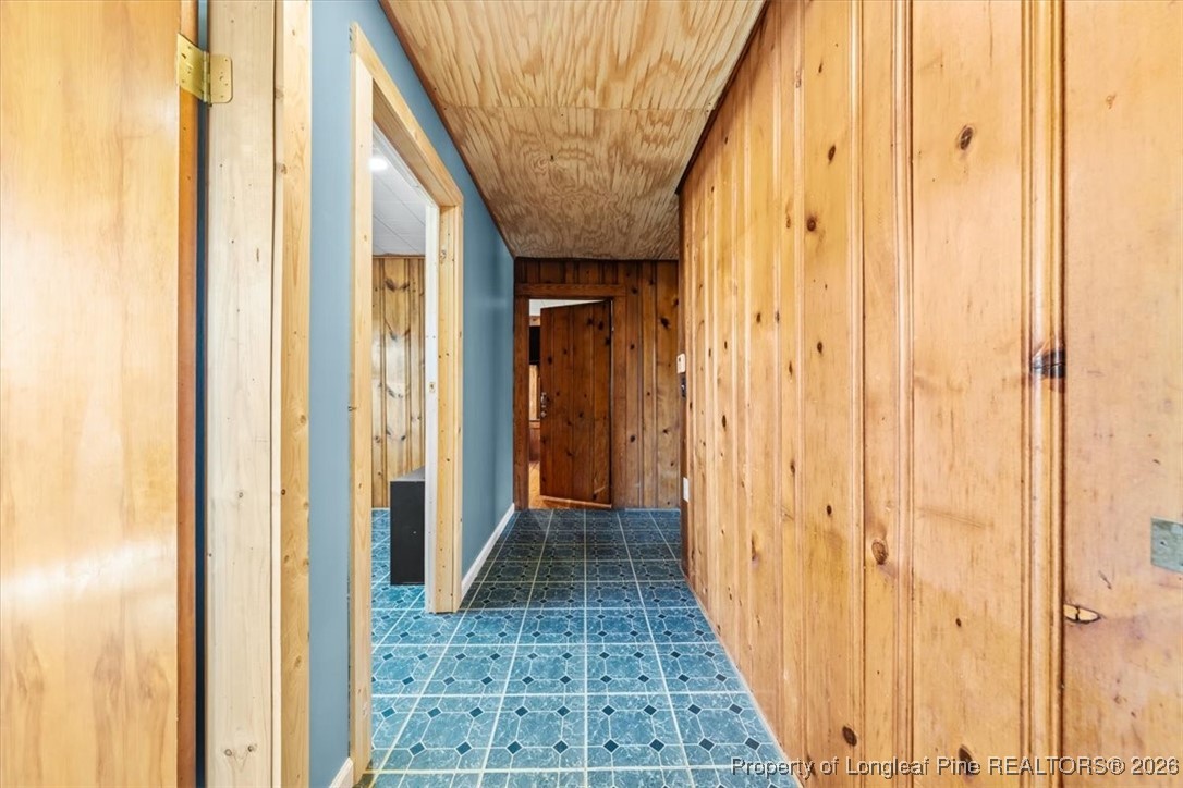 101 North Rockingham Street Robbins, NC 27325 - Photo 16 of 32 a view of a hallway with wooden floor and entryway