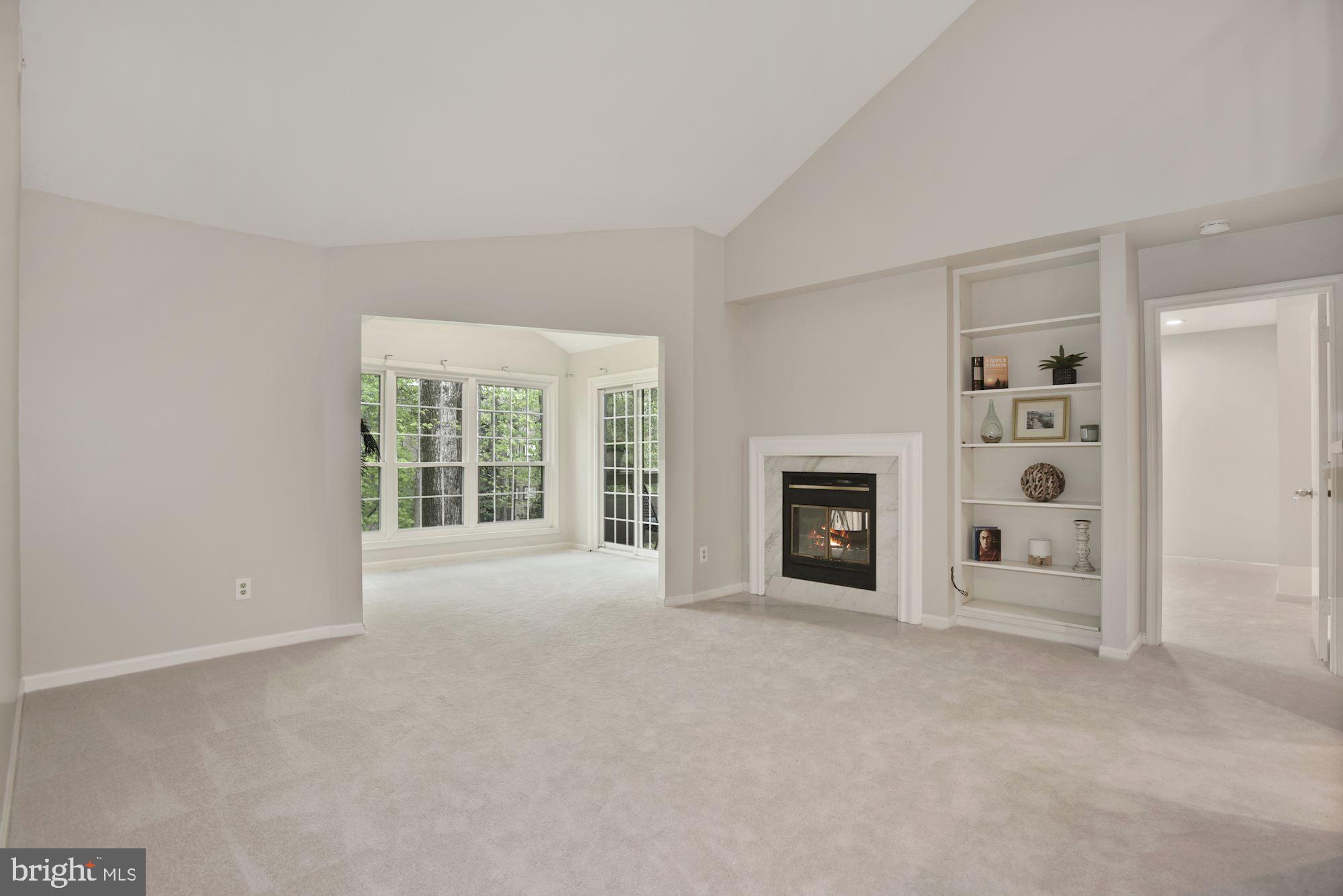 2217 Lovedale Lane, Unit 212A Reston, VA 20191 - Photo 9 of 29 Light filled living room w/vaulted ceilings