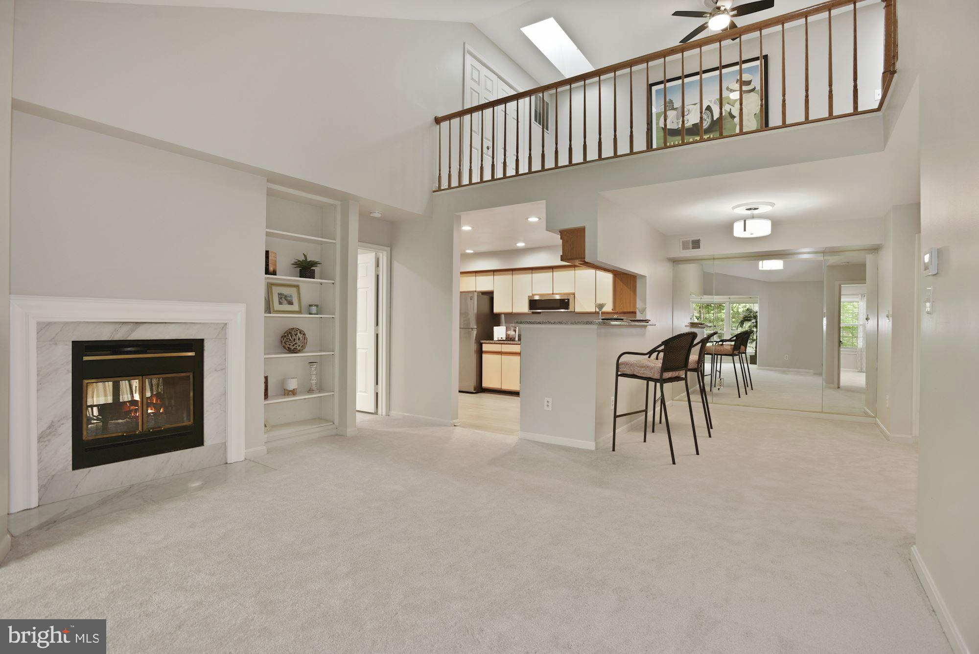2217 Lovedale Lane, Unit 212A Reston, VA 20191 - Photo 10 of 29 Cozy wood burning fireplace and b/in bookshelves