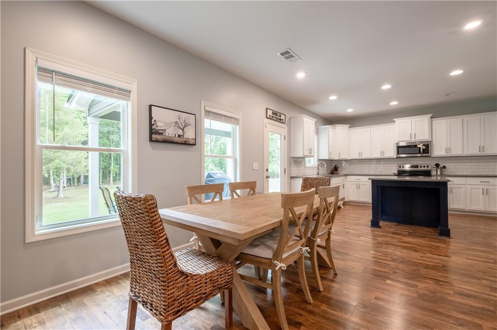 719 Fairview Road Brooks, GA 30205 - Photo 3 of 35 a view of a dining room with furniture window and wooden floor