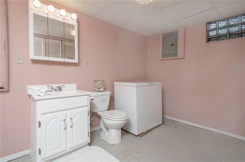 716 Main Street Coraopolis, PA 15108 - Photo 22 of 25 Lower level half bath with a wall full of closets.