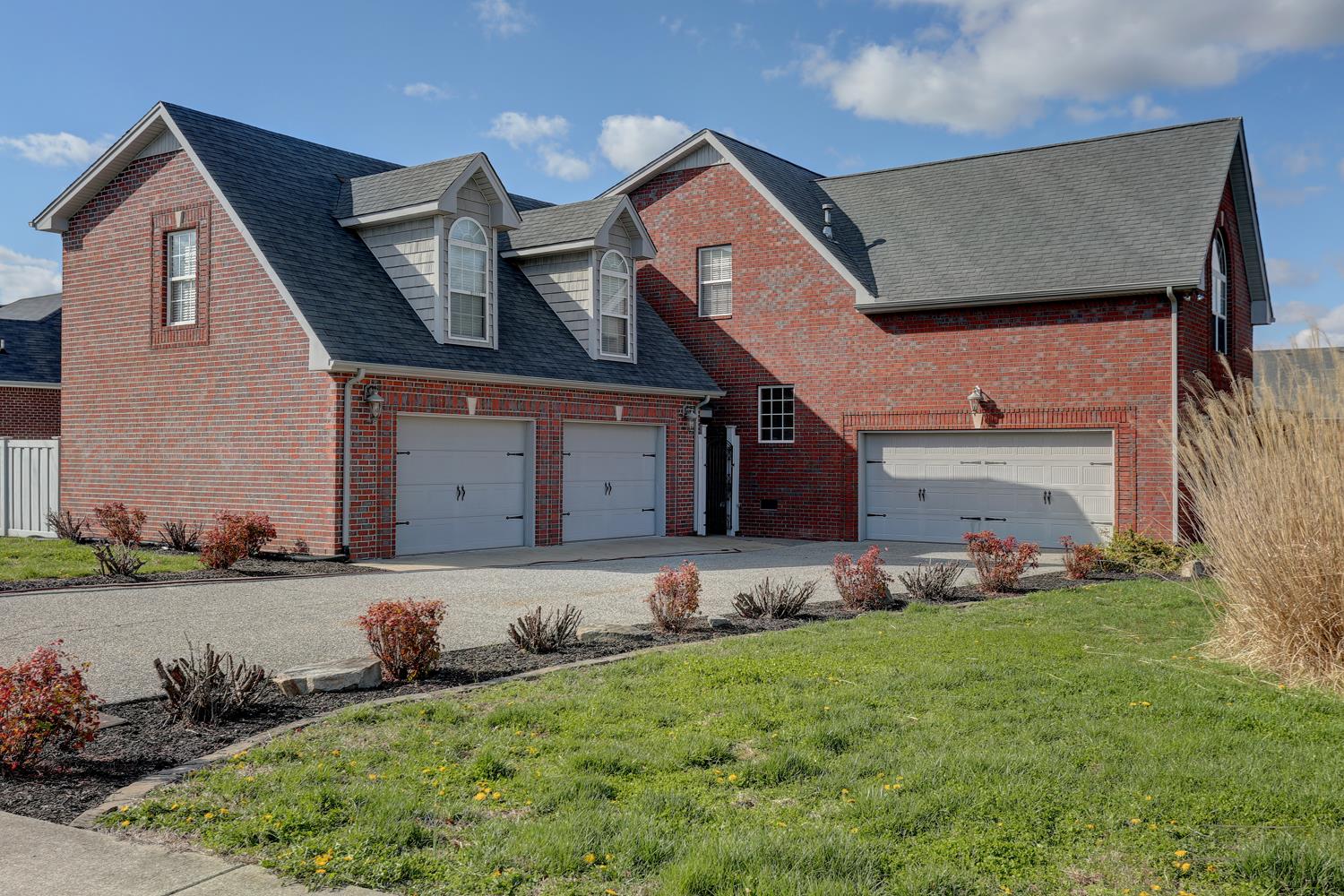 2969 Indian Ridge Boulevard White House, TN 37188 - Photo 3 of 29 a front view of a house with a garden and plants