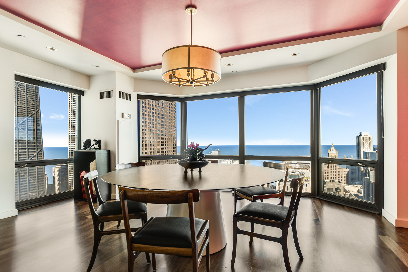 100 East Huron Street, Unit 4002 Chicago, IL 60611 - Photo 13 of 49 a view of a dining room with furniture window and wooden floor