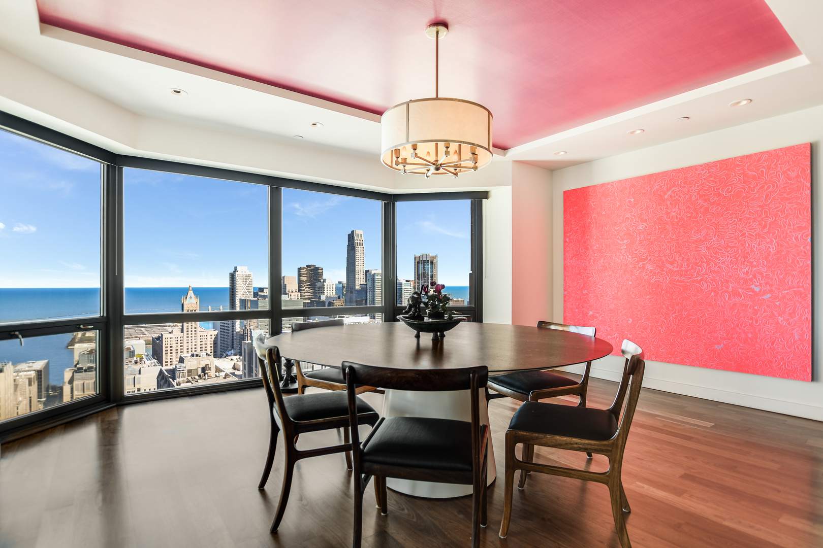 100 East Huron Street, Unit 4002 Chicago, IL 60611 - Photo 14 of 49 a view of a dining room with furniture window and wooden floor