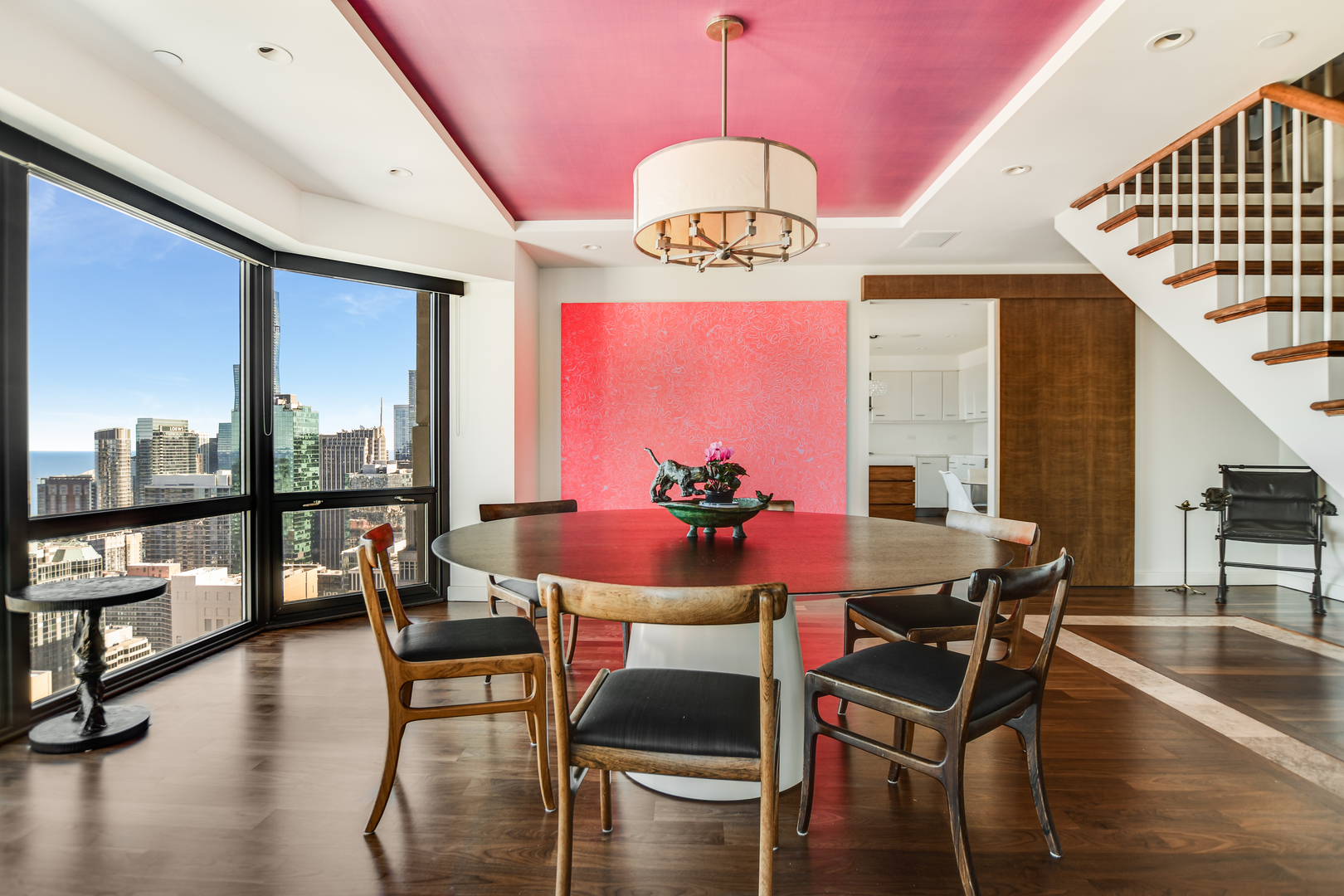 100 East Huron Street, Unit 4002 Chicago, IL 60611 - Photo 15 of 49 a view of a dining room with furniture window and wooden floor