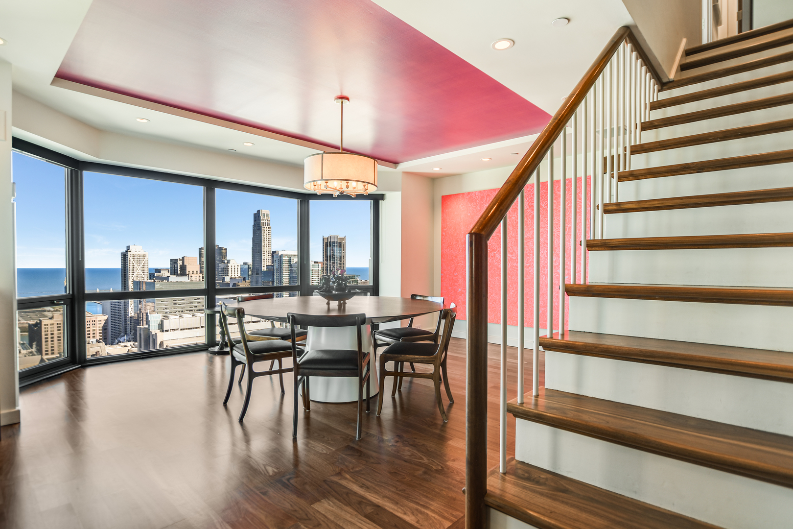 100 East Huron Street, Unit 4002 Chicago, IL 60611 - Photo 23 of 49 a dining room with furniture and wooden floor