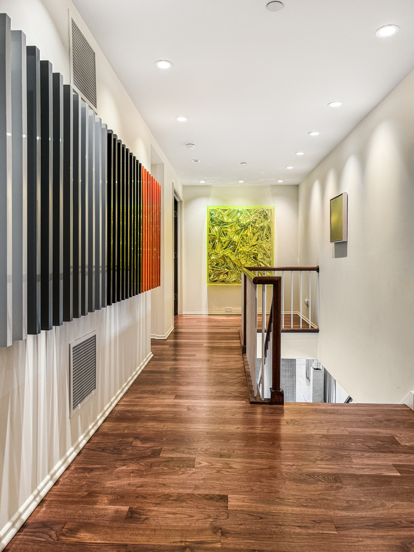 100 East Huron Street, Unit 4002 Chicago, IL 60611 - Photo 24 of 49 a view of kitchen with furniture and wooden floor
