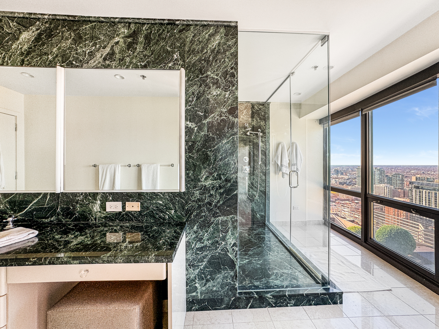 100 East Huron Street, Unit 4002 Chicago, IL 60611 - Photo 29 of 49 a bathroom with a granite countertop sink and a mirror