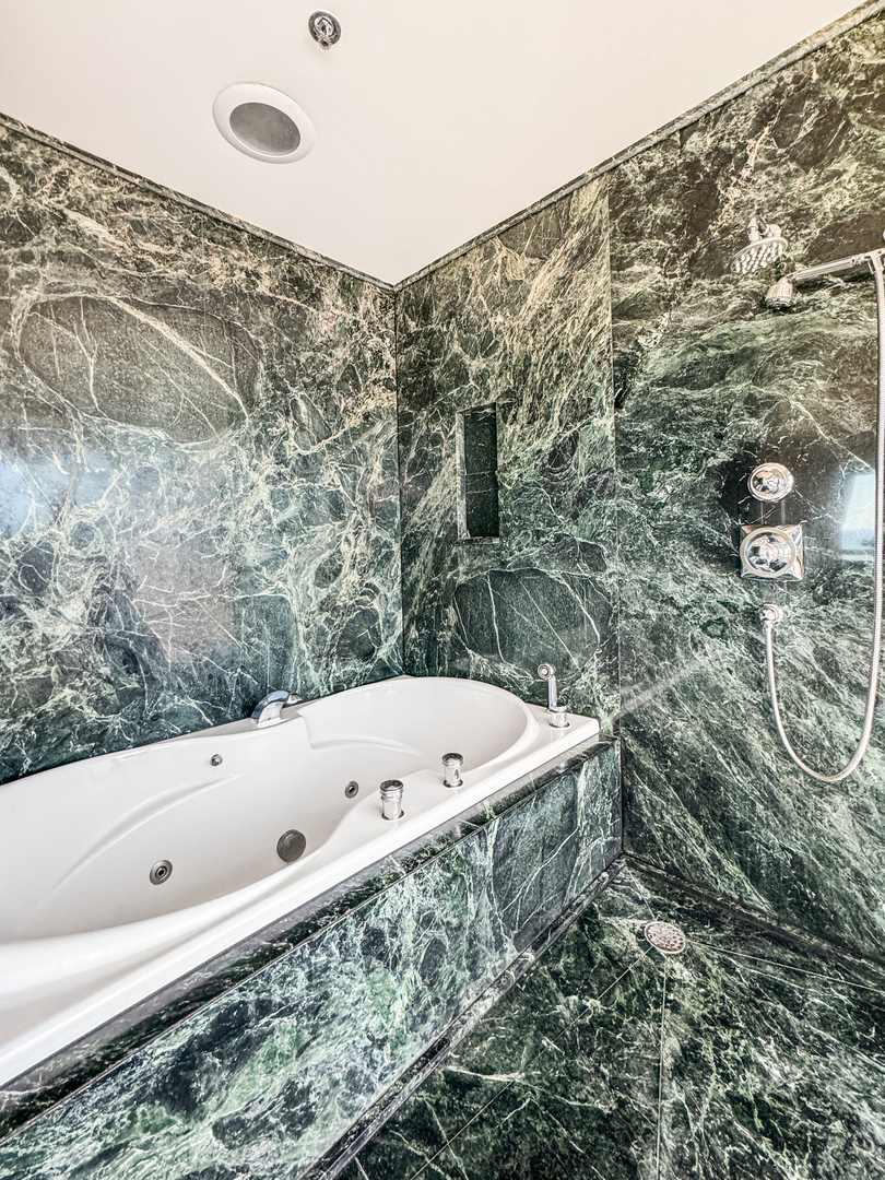 100 East Huron Street, Unit 4002 Chicago, IL 60611 - Photo 31 of 49 a bath tub sitting in a bathroom