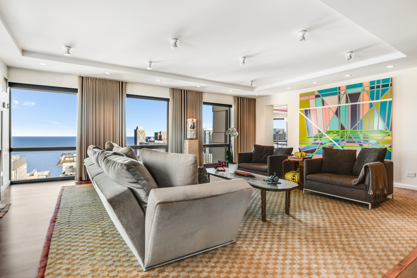 100 East Huron Street, Unit 4002 Chicago, IL 60611 - Photo 4 of 49 a living room with furniture and a rug