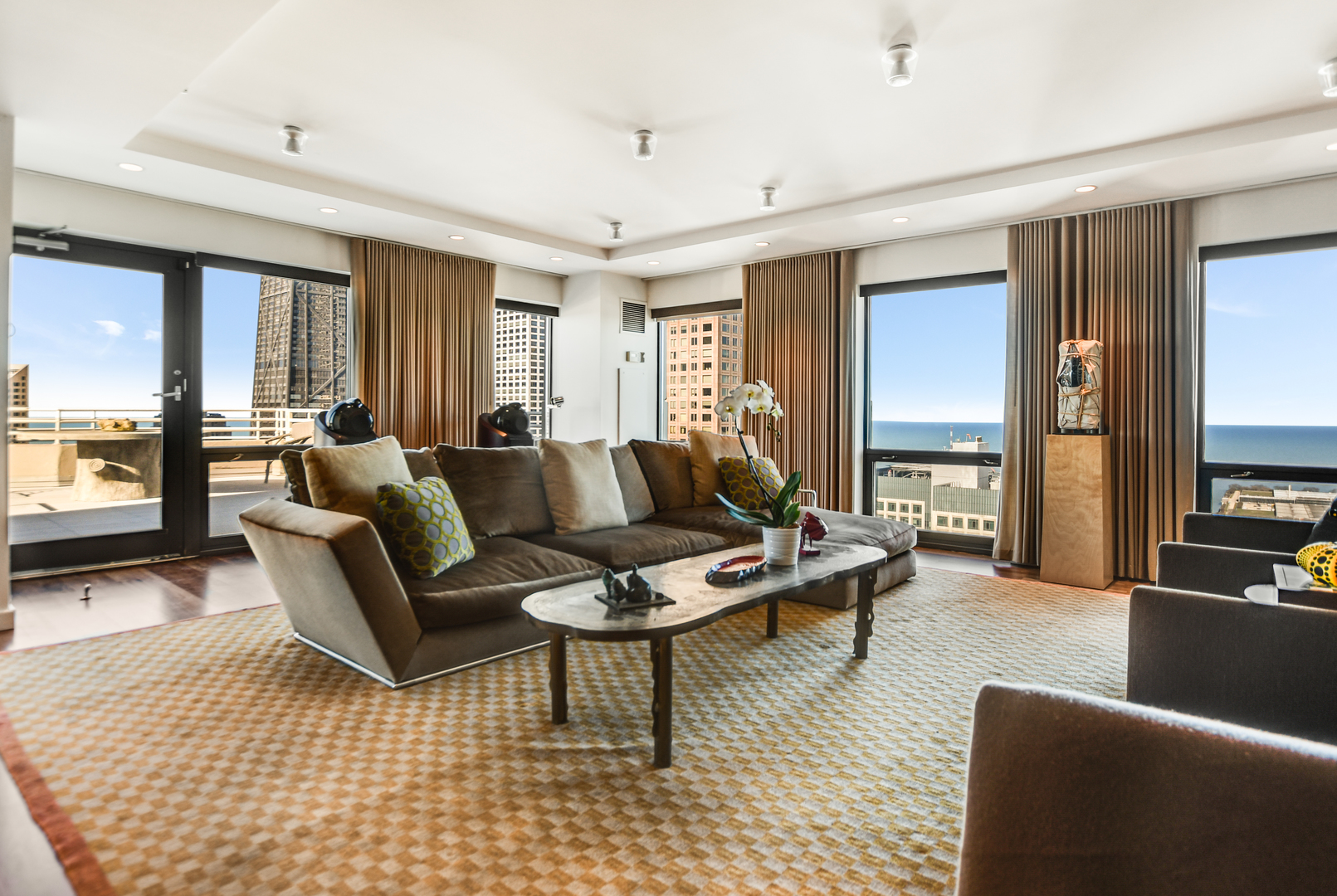 100 East Huron Street, Unit 4002 Chicago, IL 60611 - Photo 6 of 49 a living room with furniture and a flat screen tv